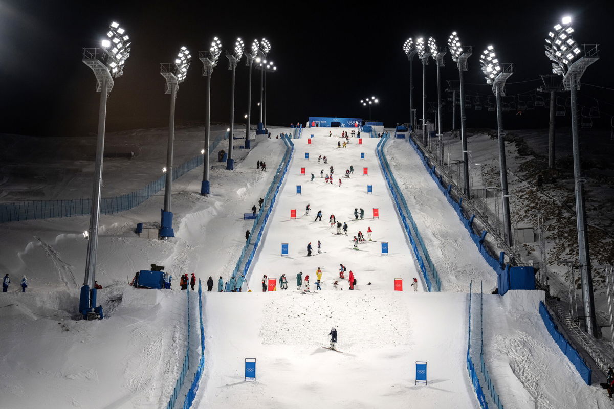 <i>Carl Court/Getty Images</i><br/>Team members check the course before a freestyle skiing moguls practice session at Genting Snow Park on February 1