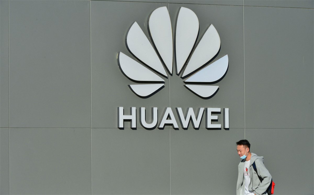 <i>VCG/Getty Images</i><br/>A man walks past a Huawei store on October 12
