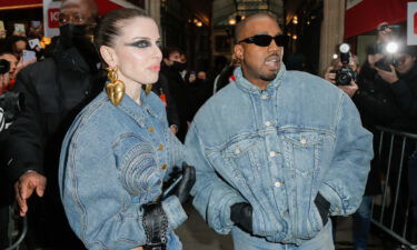 Julia Fox and Kanye West are pictured during Paris Fashion Week in January.