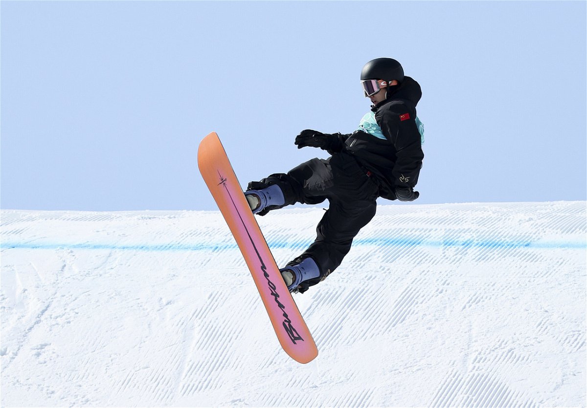 <i>Jean Catuffe/Getty Images</i><br/>China's Su Yiming performs a trick during the men's snowboard big air final on Day 11 of the Beijing Winter Olympics.