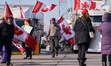 Protestors against Covid-19 vaccine mandates block the roadway at the Ambassador Bridge border crossing in Windsor