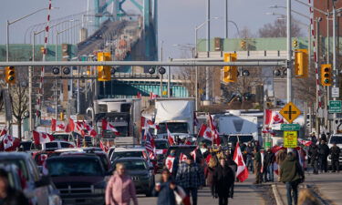 Protestors against Covid-19 vaccine mandates block the roadway at the Ambassador Bridge border crossing in Windsor