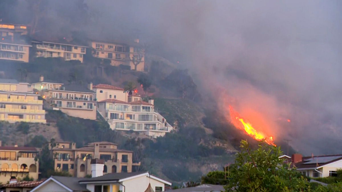 <i>KCAL/KCBS</i><br/>Residents in the Irvine Cove and Emerald Bay areas of Laguna Beach are under an immediate evacuation order due a brush fire that is threatening homes and other structures