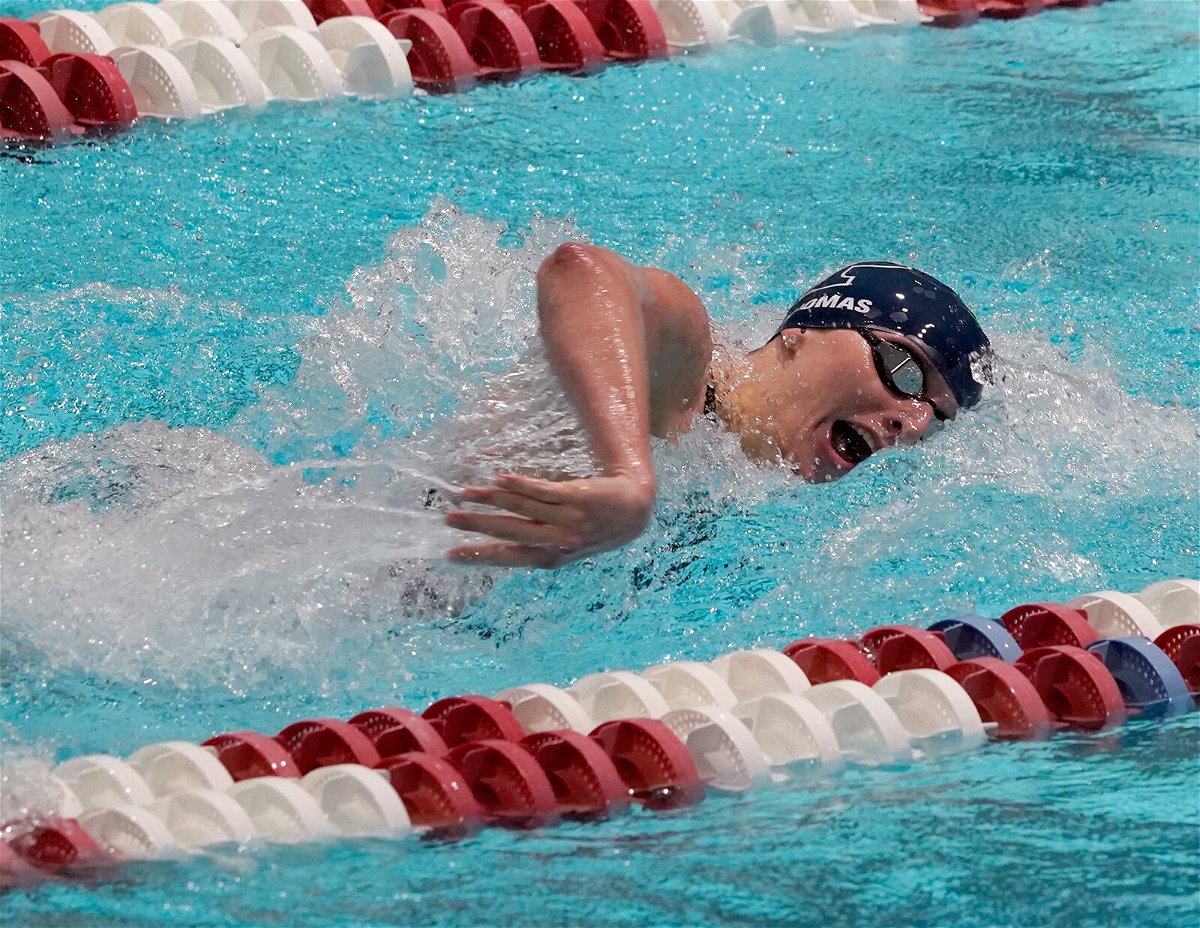 <i>Mary Schwalm/AP</i><br/>Lia Thomas swims in a qualifying heat of the 100-yard freestyle at the Ivy League Women's Swimming and Diving Championships at Harvard University