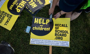 Michelle Wong makes a sign during a rally in support of the San Francisco School Board recall at Carl Larsen Park in San Francisco on February 12.