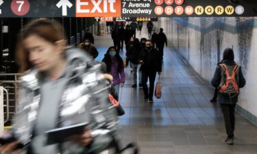 People walk through a subway station in Manhattan on January 19