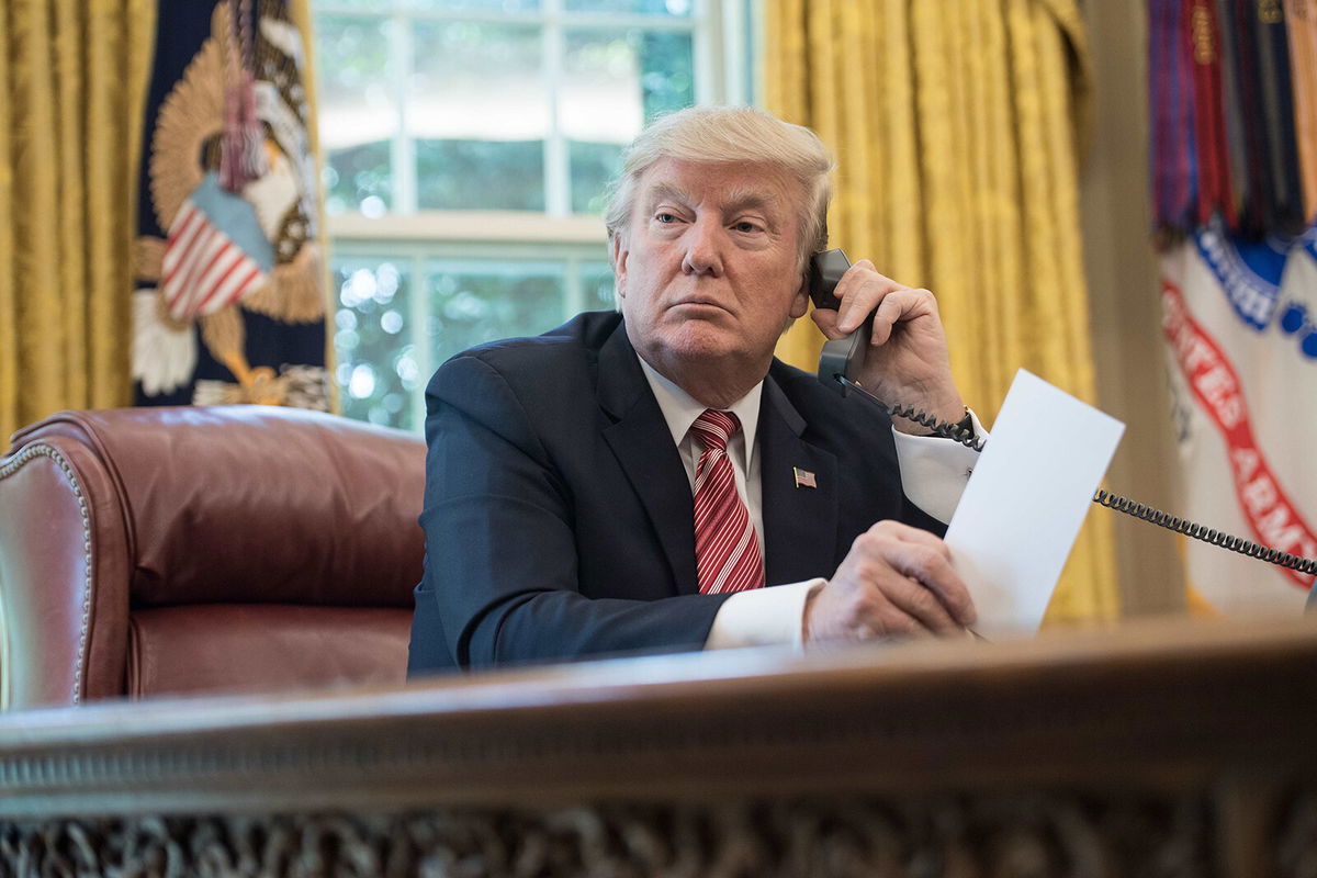 <i>Nicholas Kamm/AFP/Getty Images</i><br/>President Donald Trump in the Oval Office at the White House