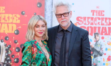 James Gunn and Jennifer Holland attend "The Suicide Squad" film premiere in 2021. "The Suicide Squad" director posted a photo of Holland sporting an engagement ring on his verified Instagram account over the weekend.