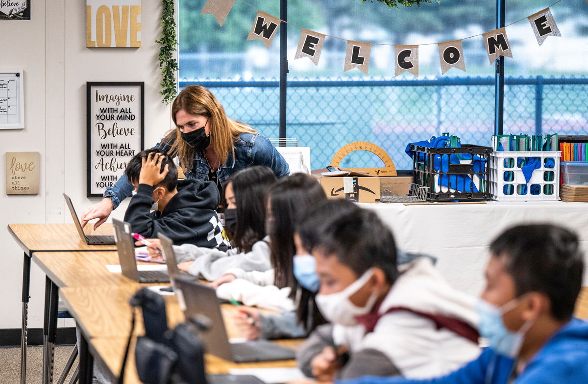 <i>Paul Bersebach/Orange County Register/Getty Images</i><br/>Students and a teacher at the Vista View Middle School in Huntington Beach