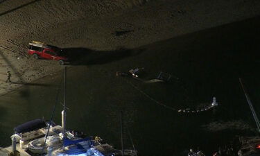 A Huntington Beach Police Department helicopter crashed into the water off Newport Beach Saturday in front of dozens of people on the beach.