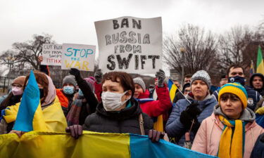 Protesters demand that Russia be banned from the SWIFT system during a rally for Ukraine at the White House.  This system facilitates international interbank transactions