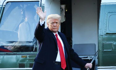 Outgoing US President Donald Trump waves as he boards Marine One at the White House in Washington