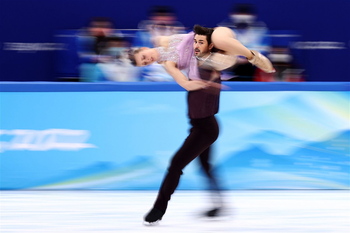 <i>Dean Mouhtaropoulos/Getty Images</i><br/>Madison Hubbell and Zachary Donohue of the US skate during the Beijing Winter Olympics Games.