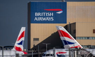 The British Airways livery on the tail fins of passenger aircraft at Heathrow Airport in London