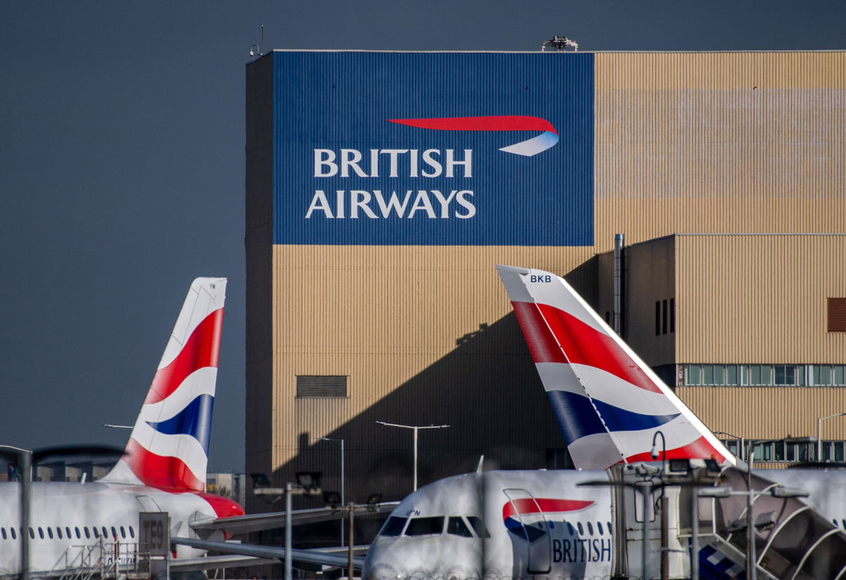 <i>Chris J. Ratcliffe/Bloomberg/Getty Images</i><br/>The British Airways livery on the tail fins of passenger aircraft at Heathrow Airport in London