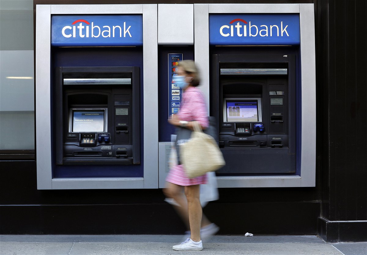 <i>Peter Foley/Bloomberg/Getty Images</i><br/>A pedestrian wearing a protective mask walks past a Citigroup Inc. Citibank bank branch in New York