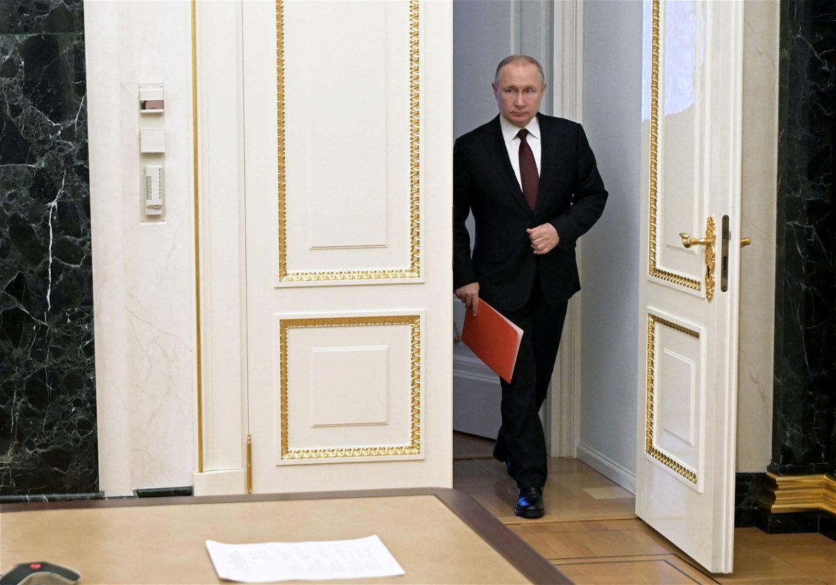 <i>Alexey Nikolsky/Kremlin/Sputnik/Reuters</i><br/>Russian President Vladimir Putin enters a hall before a meeting with members of the Security Council via a video link in Moscow