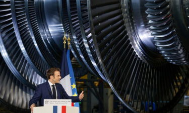 French President Emmanuel Macron delivers a speech at the GE Steam Power System main production site for its nuclear turbine systems on February 10