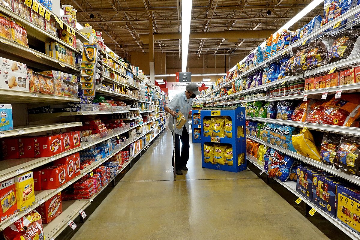 <i>Joe Raedle/Getty Images</i><br/>A customer shops at a grocery store on February 10 in Miami
