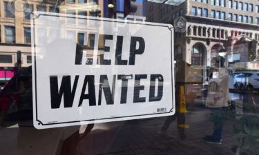 A 'help wanted' sign is posted in front of restaurant on February 4 in Los Angeles