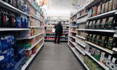 People shop for groceries in a Manhattan store on January 12 in New York City. America's high prices didn't budge in January. Another key inflation measure showed prices rising last month.