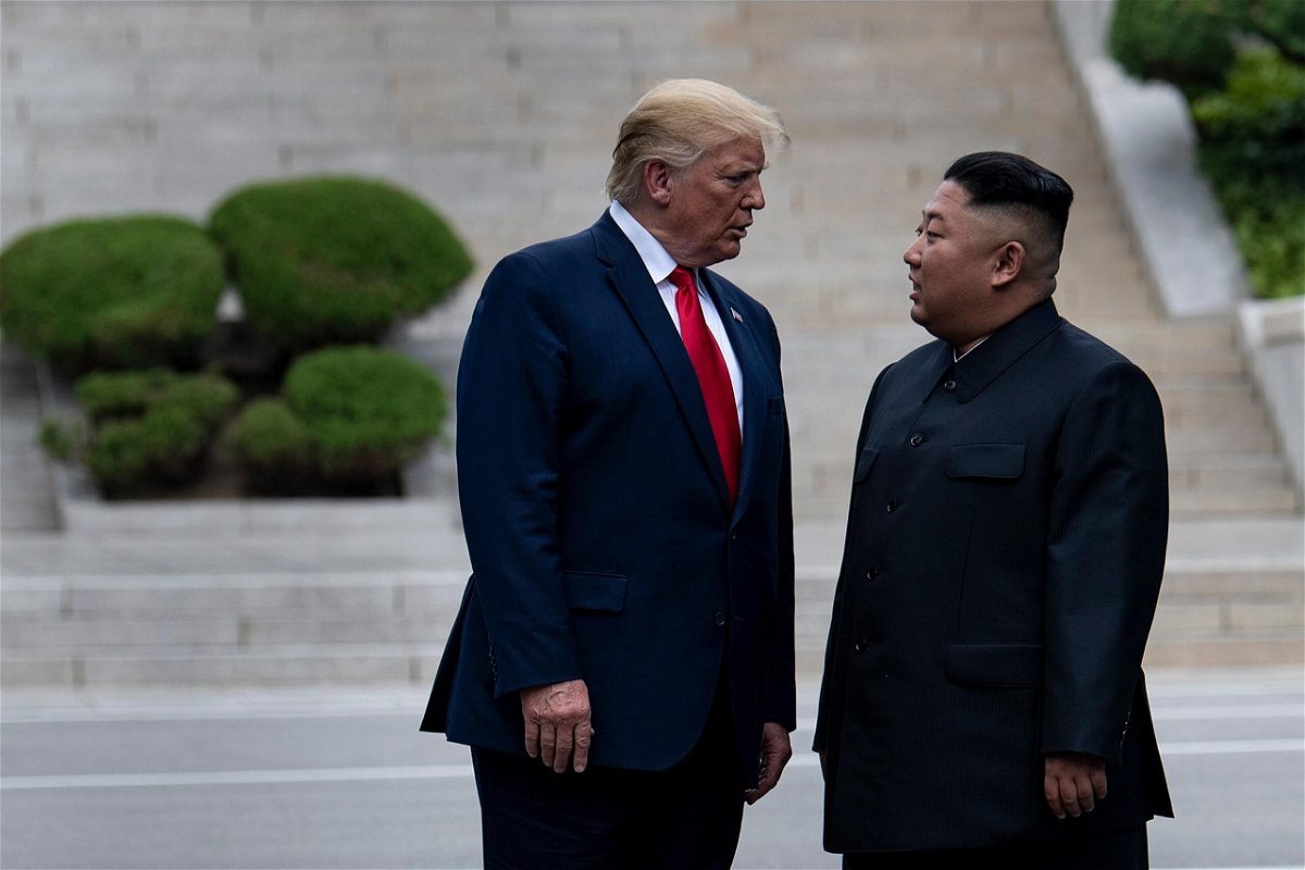 <i>BRENDAN SMIALOWSKI/AFP/Getty Images</i><br/>Then-President Donald Trump and North Korea's leader Kim Jong-un stand on North Korean soil while walking to South Korea in the Demilitarized Zone in June 2019. Some records involving correspondence with Kim were among those sought by the Archives.