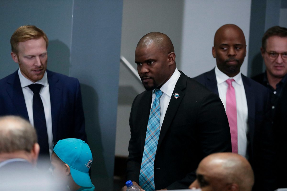 <i>Brynn Anderson/AP</i><br/>Brian Flores arrives for a news conference announcing his hiring as the new Miami Dolphins head coach on February 4