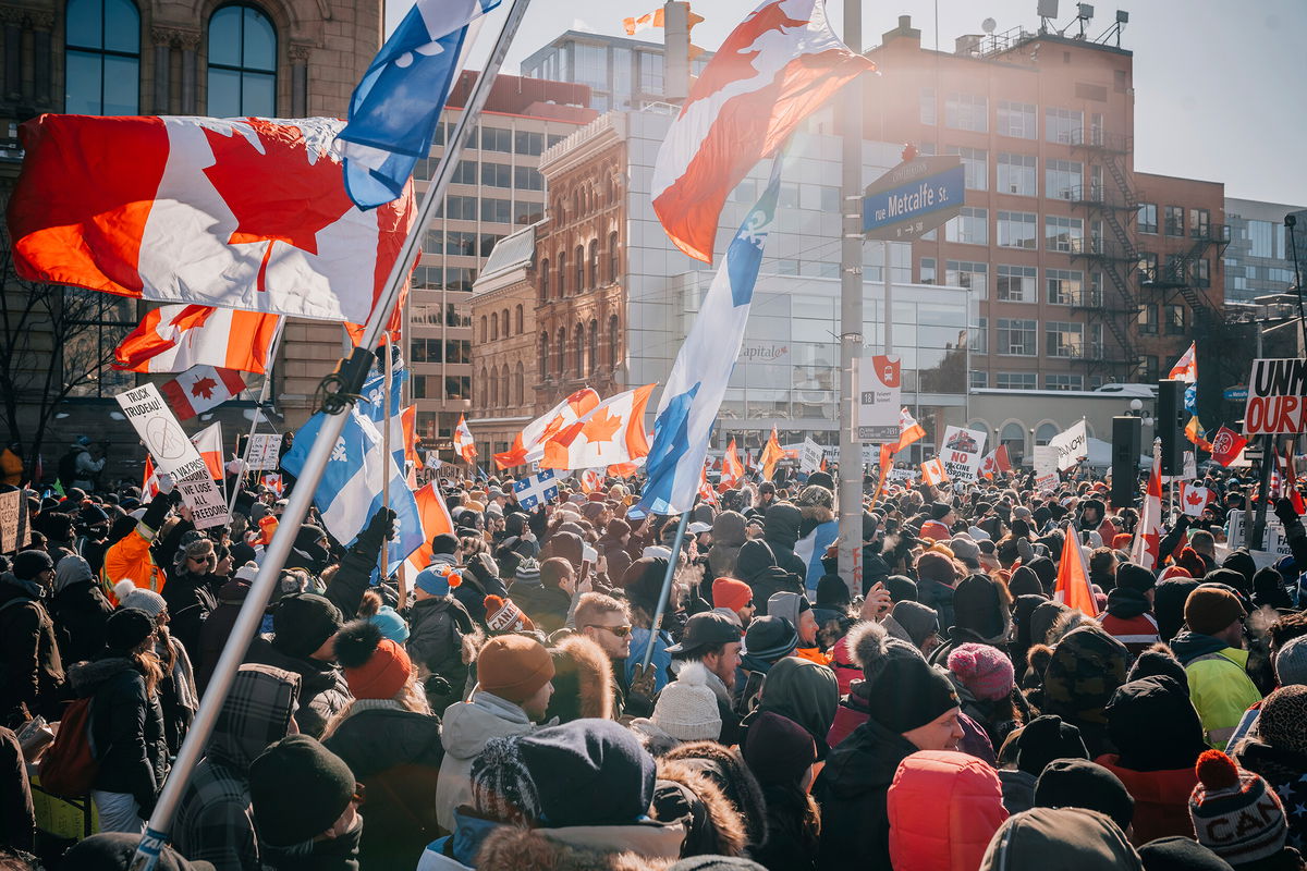 <i>Olga Samotoy/SPTNK/AP</i><br/>People gather in the street