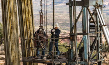 The well service crew on a workover rig uses power tongs to reconnect the sections of tubing on an oil well. Russia's invasion of Ukraine has sent oil futures above $100 a barrel for the first time since 2014 and will probably bring $4-a-gallon gasoline to much of the United States.