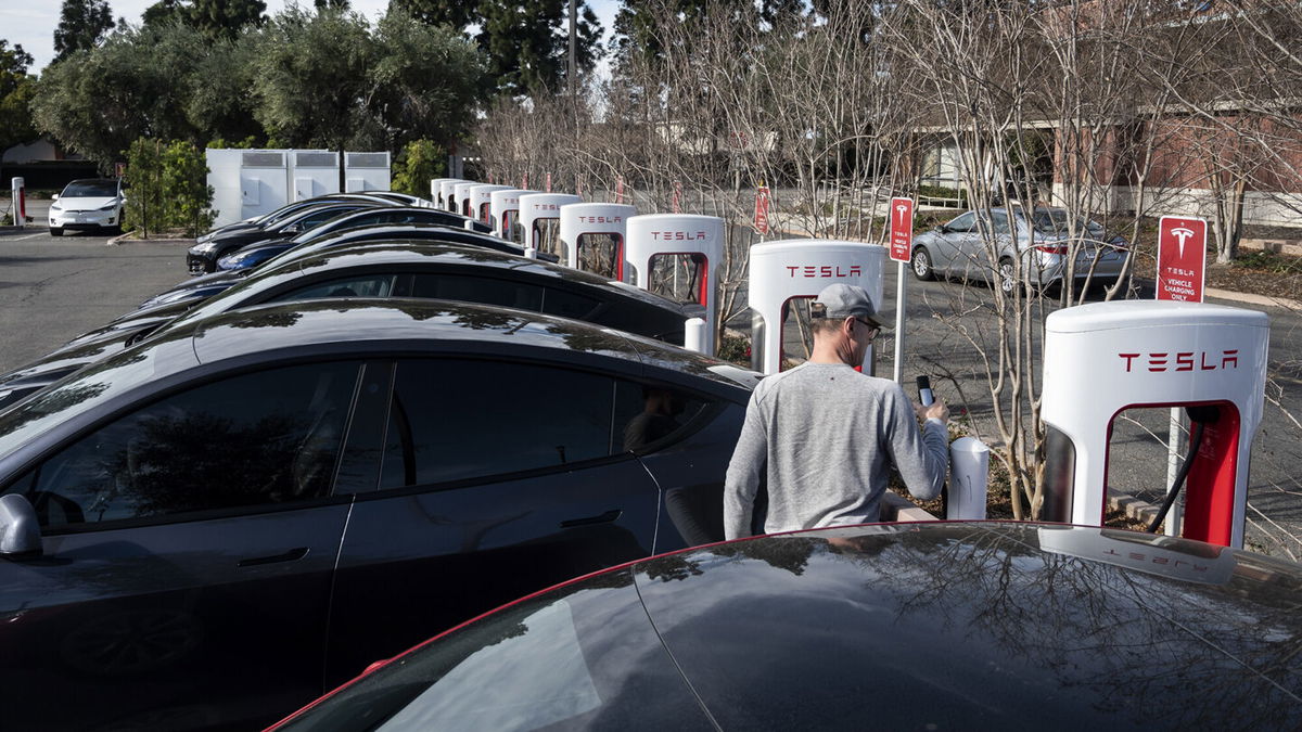 <i>Paul Bersebach/MediaNews Group/Orange County Register/Getty Images</i><br/>Tesla cars charge at a Supercharger station on Culver Ave. in Irvine