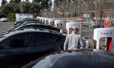 Tesla cars charge at a Supercharger station on Culver Ave. in Irvine