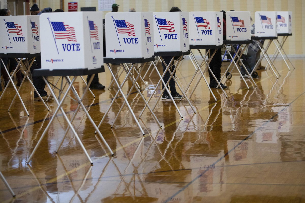 <i>Emily Elconin/Bloomberg/Getty Images</i><br/>Voters cast ballots at a polling location in Southfield