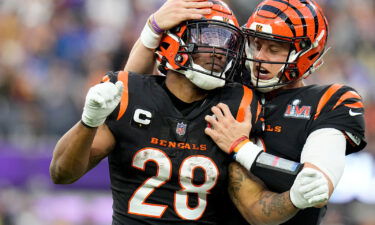 Cincinnati Bengals running back Joe Mixon (28) celebrates with quarterback Joe Burrow during the first half of the NFL Super Bowl 56 football game Sunday