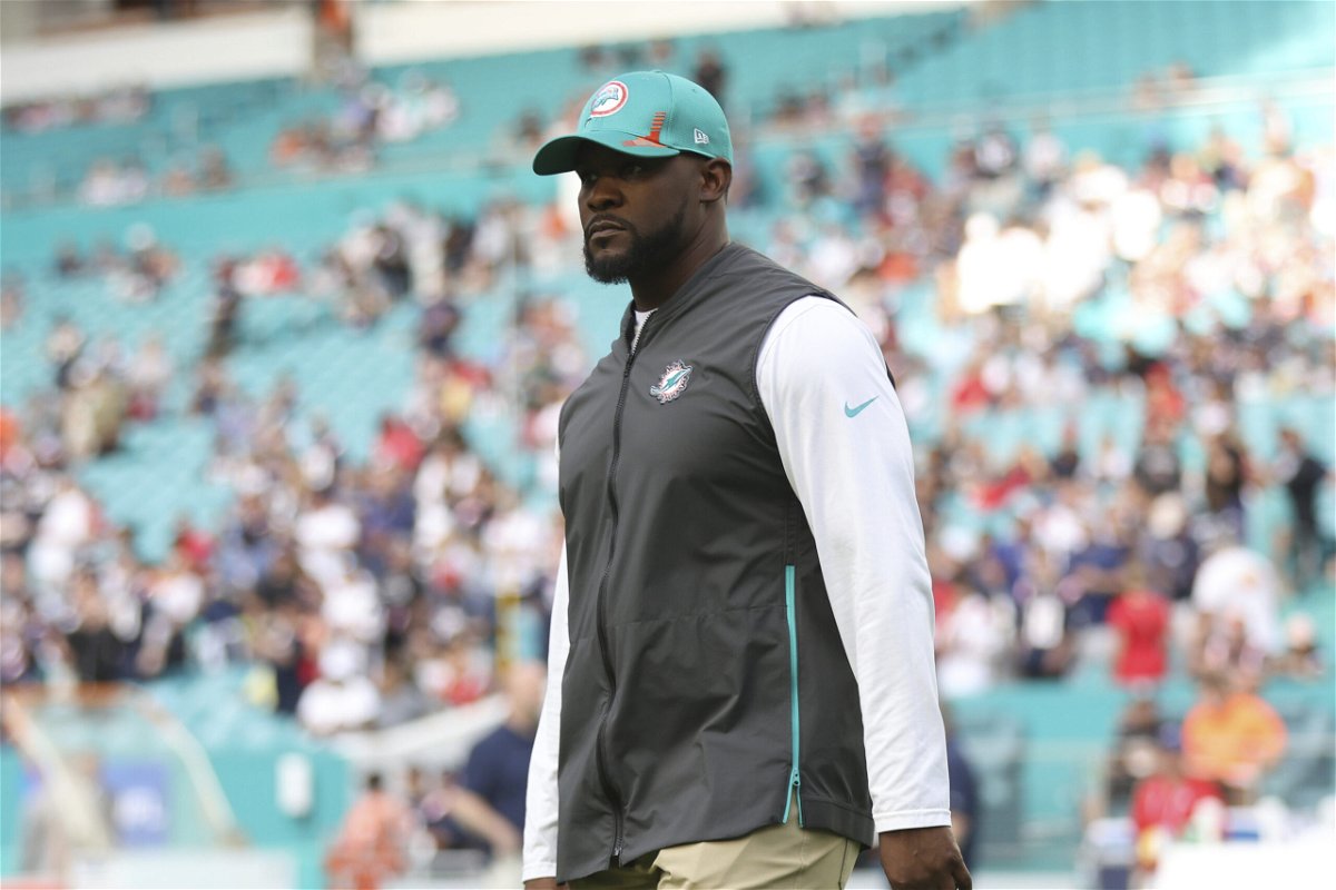 <i>Perry Knotts/AP</i><br/>Miami Dolphins head coach Brian Flores stands on the field prior to an NFL football game against the New England Patriots