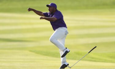 Harold Varner III celebrates after sinking an eagle putt on the 18th to win the Saudi International.