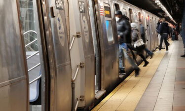 People board a subway on January 19 in New York City. One man died and another was injured after they were struck by subway trains in different areas of New York City within hours of each other Saturday night