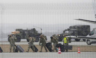 U.S. Army troops of the 82nd Airborne Division unloading vehicles from a transport plane after arriving from Fort Bragg at the Rzeszow-Jasionka airport in southeastern Poland