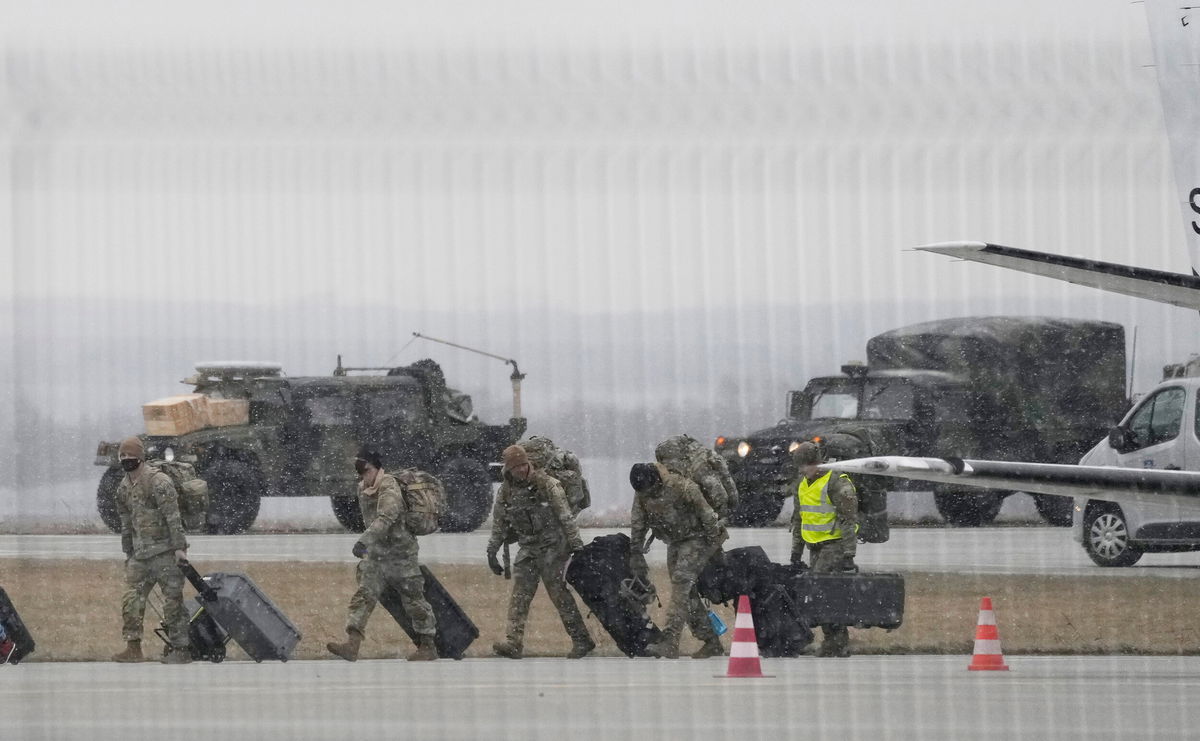 <i>Czarek Sokolowski/AP</i><br/>U.S. Army troops of the 82nd Airborne Division unloading vehicles from a transport plane after arriving from Fort Bragg at the Rzeszow-Jasionka airport in southeastern Poland