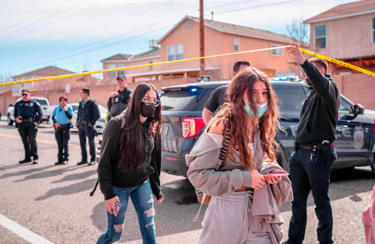 <i>Roberto E. Rosales/Albuquerque Journal/ZUMA</i><br/>Police and students are seen after a fatal shooting near an Albuquerque high school Friday.