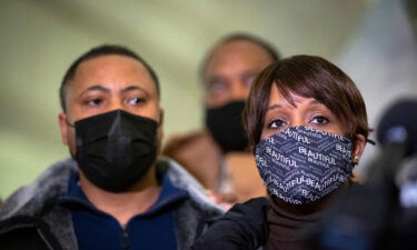 Father Andre Locke and mom Karen Wells attend a news conference last week.