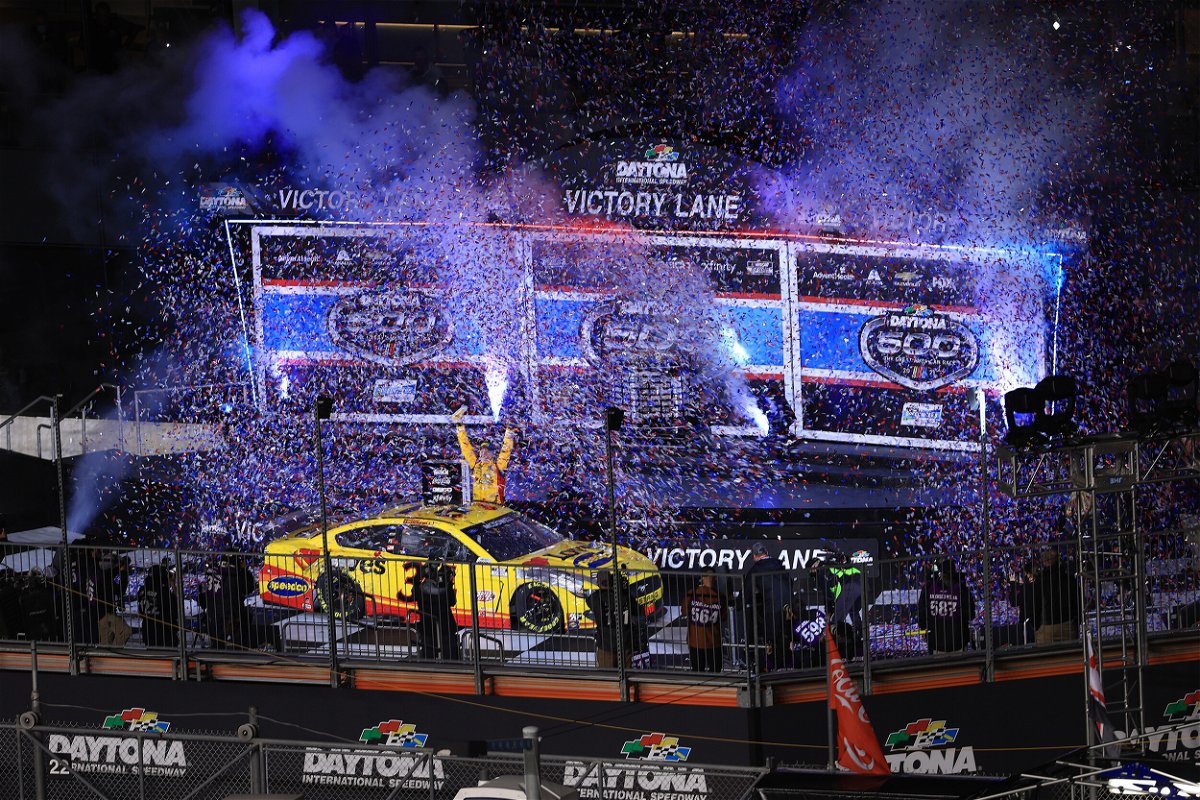 <i>Mike Ehrmann/Getty Images</i><br/>Michael McDowell celebrates in victory lane after winning the 2021 Daytona 500.