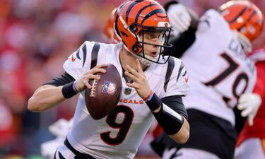 Quarterback Joe Burrow #9 of the Cincinnati Bengals rolls out to pass against the Kansas City Chiefs during the second half of the AFC Championship Game at Arrowhead Stadium on January 30 in Kansas City