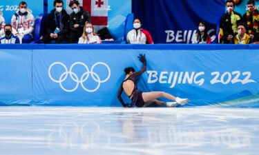 Yi Zhu of Team China falls during the Women Single Skating Short Program Team Event on day two of the Beijing 2022 Winter Olympics.