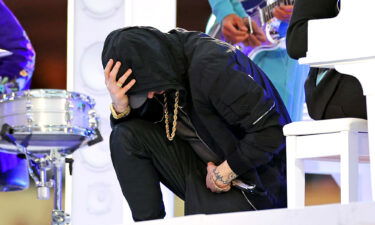 Eminem takes a knee during the Pepsi Super Bowl LVI Halftime Show at SoFi Stadium on Sunday in Inglewood