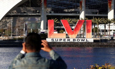 A man takes a photo of SoFi Stadium ahead of Super Bowl LVI between the Cincinnati Bengals and Los Angeles Rams on February 10