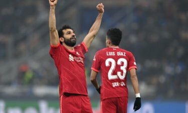 Mohamed Salah of Liverpool celebrates after scoring their side's second goal during the UEFA Champions League Round Of Sixteen Leg One match between Inter and Liverpool FC.