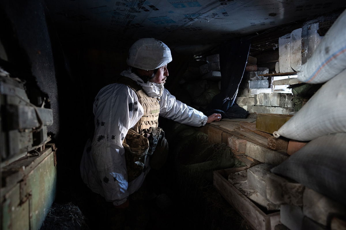 <i>Wolfgang Schwan/Anadolu Agency/Getty Images</i><br/>A Ukrainian soldier surveys the area from his position outside of Donetsk