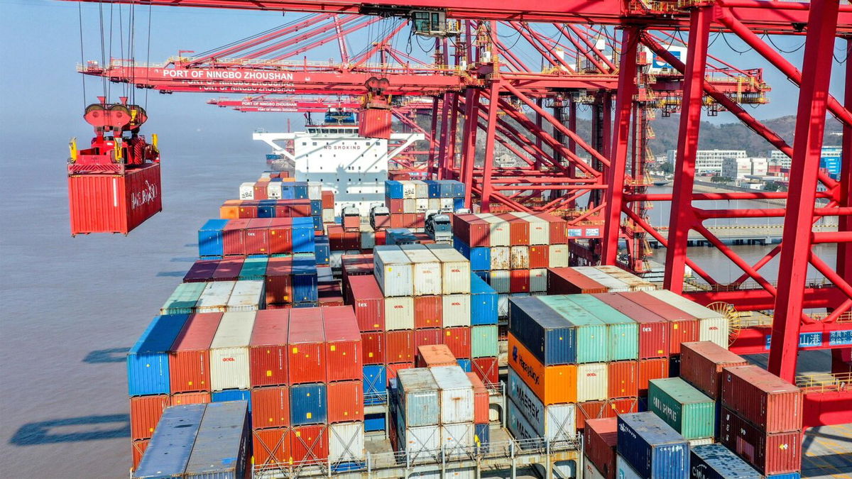 <i>Yao Feng/VCG/Visual China Group/Getty Images</i><br/>Aerial view of loading and unloading operations on a cargo ship on January 19 in Zhoushan