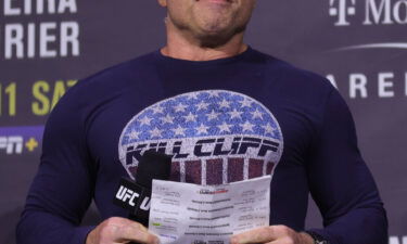 Joe Rogan introduces fighters during the UFC 269 ceremonial weigh-in  at MGM Grand Garden Arena on December 10