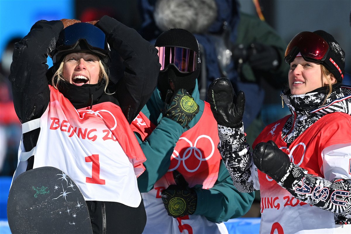 <i>Angelika Warmuth/dpa/Picture Alliance/Getty Images</i><br/>Sadowski-Synnott celebrates after her Olympic victory with runner-up Marino (r).